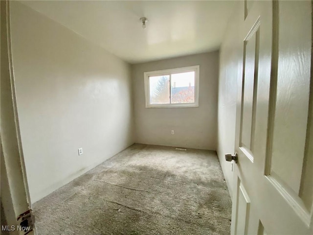 unfurnished room featuring carpet flooring