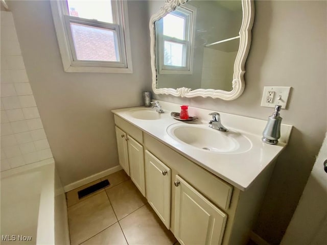 bathroom with tile patterned floors and vanity