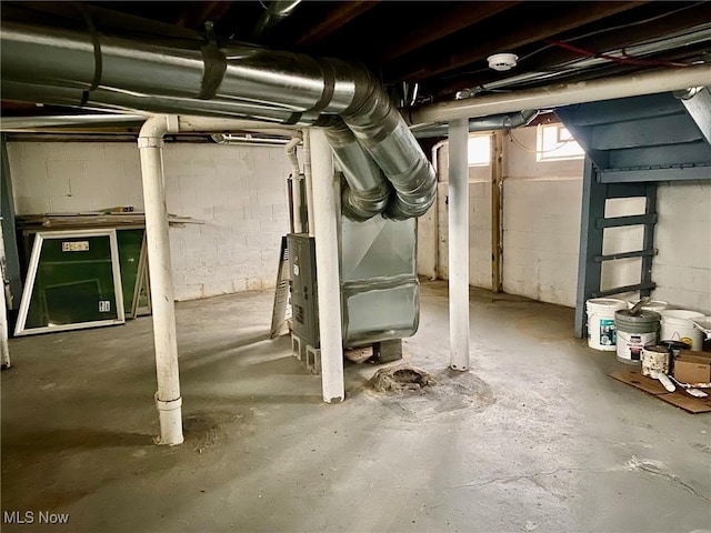 basement featuring heating unit