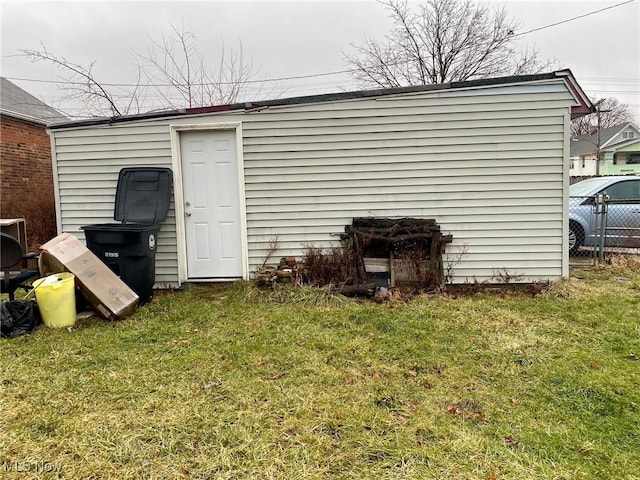 view of outdoor structure with a lawn