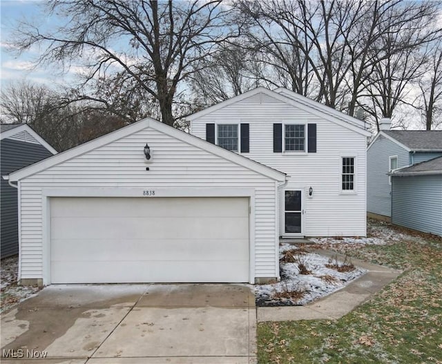 view of front of property with a garage