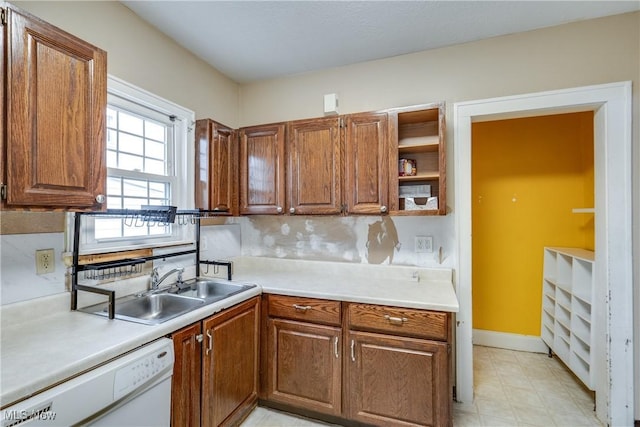 kitchen featuring white dishwasher and sink