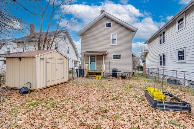 rear view of house with a shed