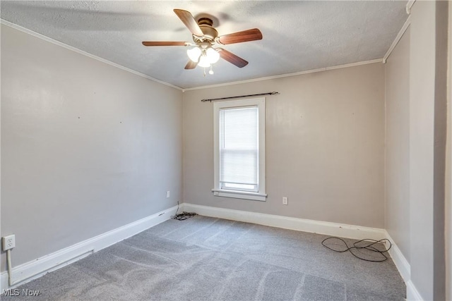 unfurnished room featuring crown molding, ceiling fan, carpet, and a textured ceiling