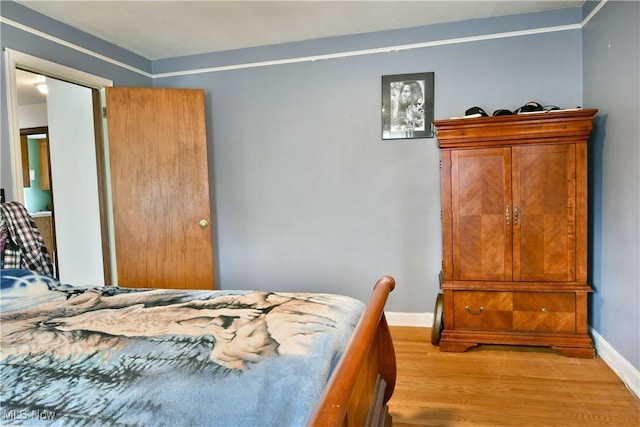 bedroom featuring light hardwood / wood-style floors