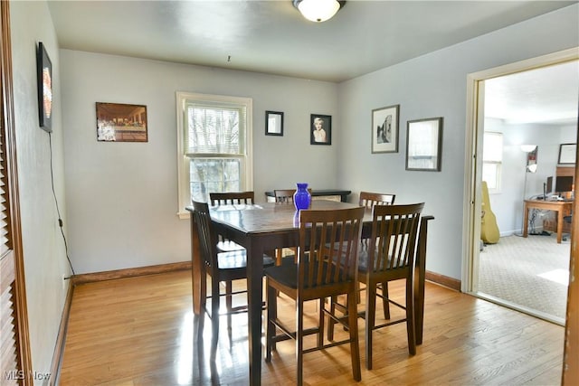 dining area featuring light hardwood / wood-style floors and a wealth of natural light