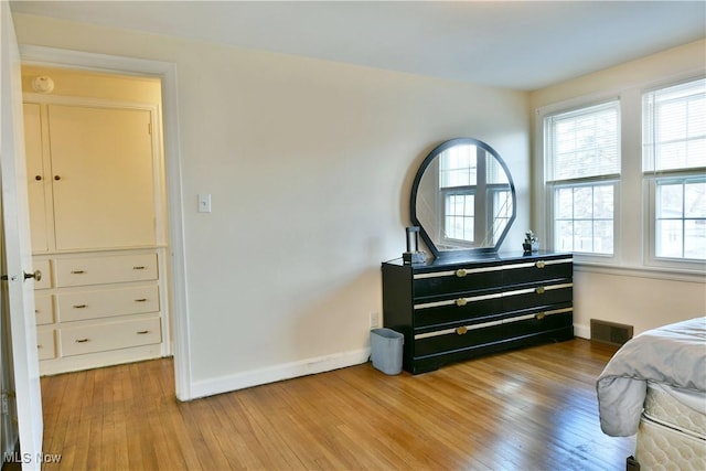 bedroom with light hardwood / wood-style floors