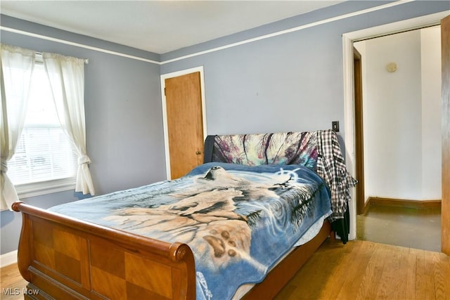 bedroom featuring light hardwood / wood-style floors