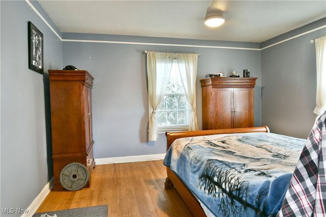 bedroom with light hardwood / wood-style flooring