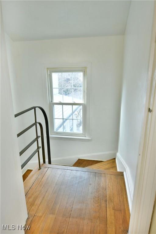 unfurnished room with light hardwood / wood-style flooring