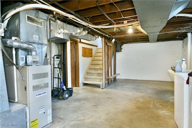 basement with washer / dryer and heating unit