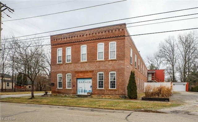 view of front of house featuring a garage and an outdoor structure