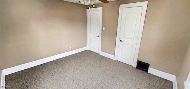 1151 Bedford Ave SW, Canton, OH 44710 - carpeted empty room with visible vents, a ceiling fan, and baseboards