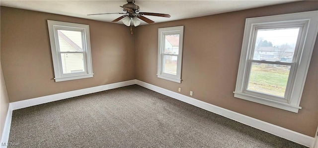 1151 Bedford Ave SW, Canton, OH 44710 - spare room featuring a ceiling fan, baseboards, and plenty of natural light