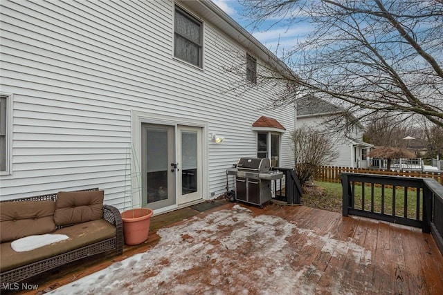 wooden terrace featuring a grill and french doors