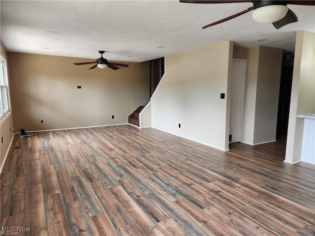 spare room featuring wood-type flooring and ceiling fan