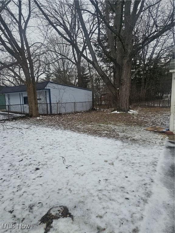 view of yard layered in snow