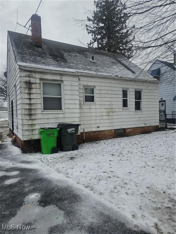 view of snow covered house