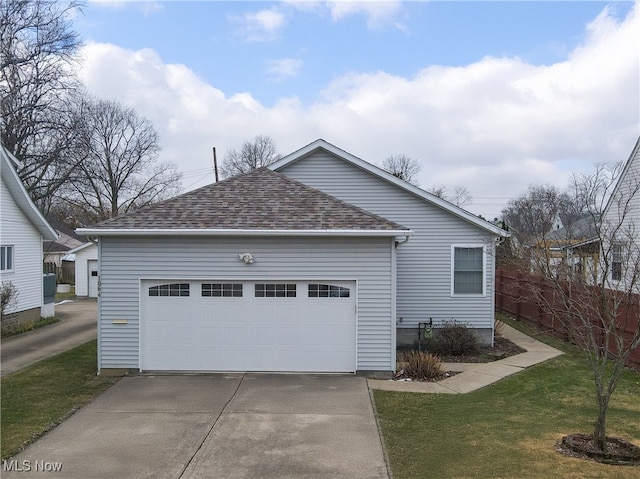 view of front facade with a garage and a front lawn