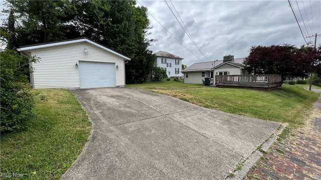 view of front of house with a garage, an outdoor structure, a front yard, and a deck