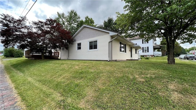 view of home's exterior with a yard