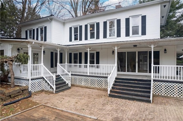 farmhouse featuring a porch