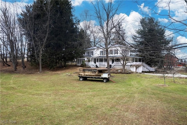 view of yard featuring covered porch