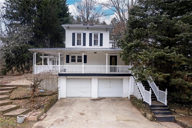 farmhouse-style home with a garage and covered porch