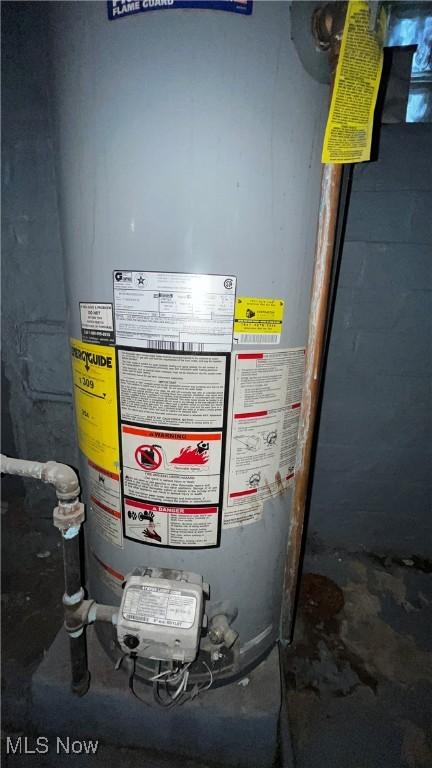 utility room with water heater