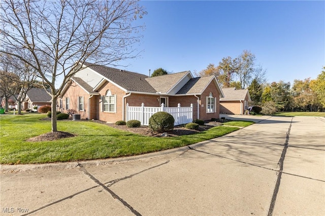 view of front facade with a garage and a front yard