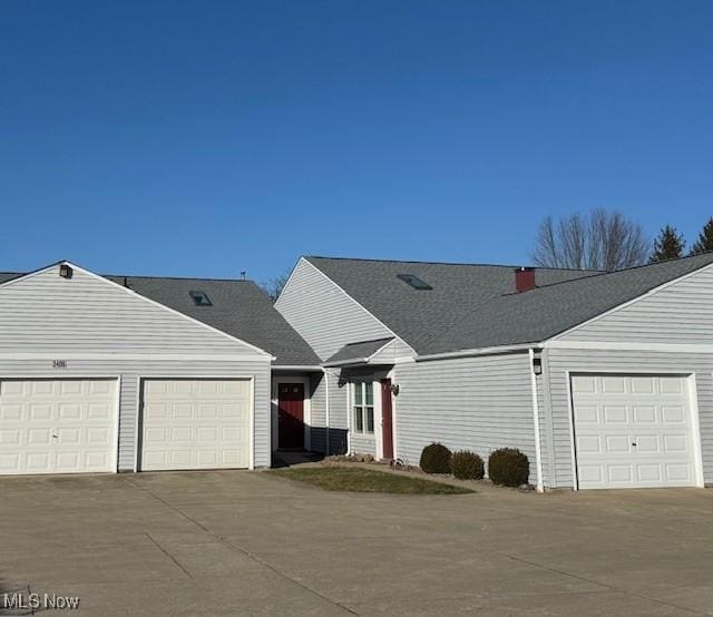 ranch-style home featuring a garage