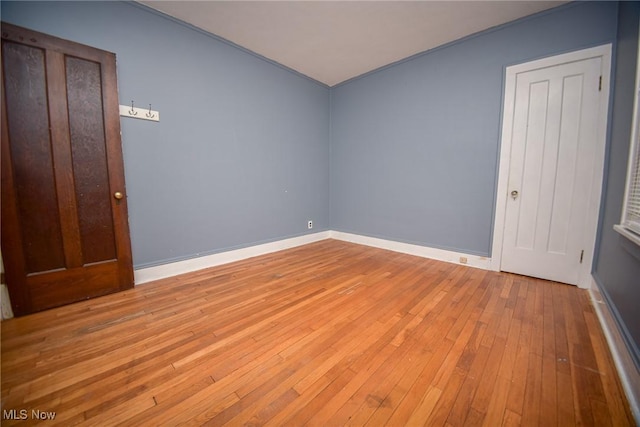 unfurnished bedroom with light wood-type flooring