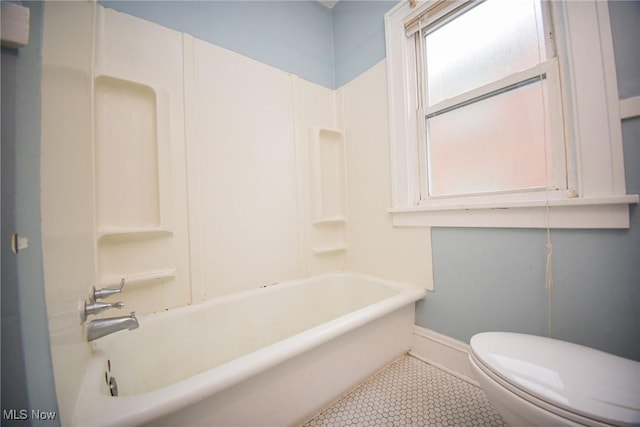 bathroom with tile patterned flooring and toilet