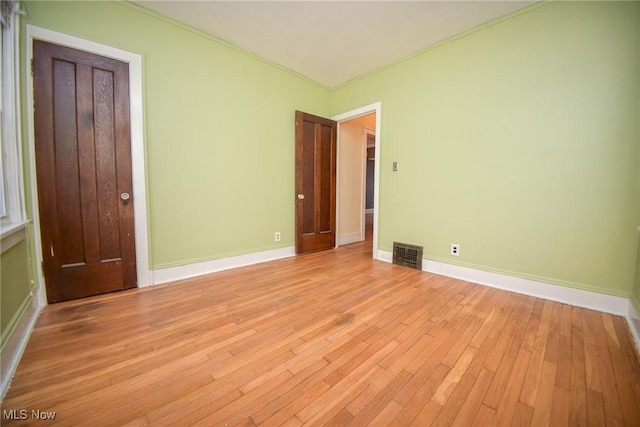 unfurnished bedroom with light hardwood / wood-style flooring