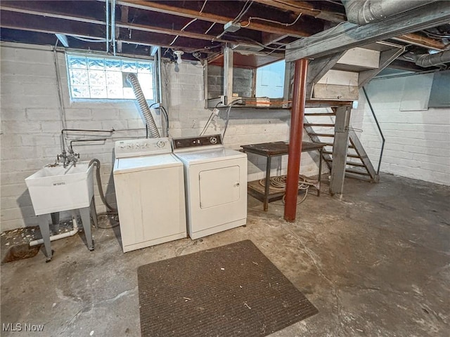 basement featuring sink and washing machine and clothes dryer