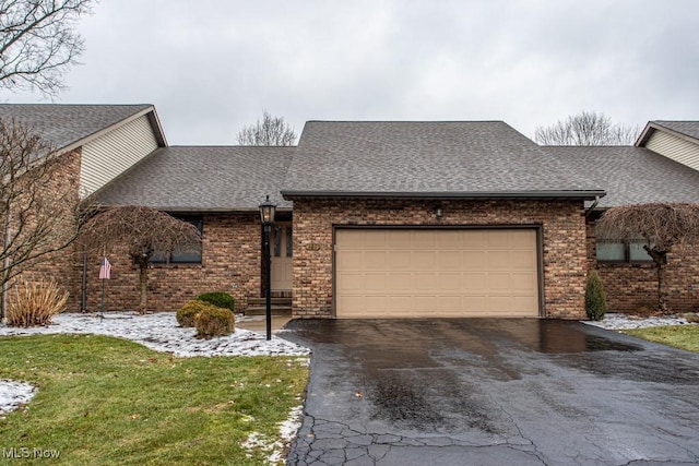 view of front of property with a garage and a front yard