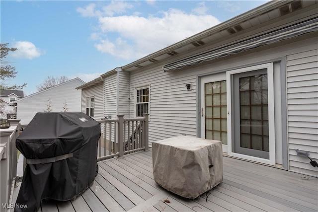 wooden terrace with area for grilling