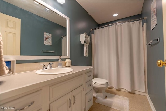 bathroom with vanity, toilet, and a shower with shower curtain