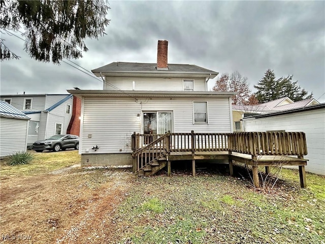 rear view of property with a deck