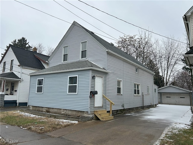 view of front of property with an outbuilding and a garage