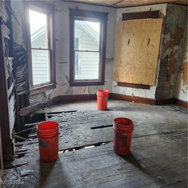 unfurnished room featuring hardwood / wood-style floors