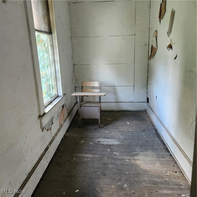 empty room with dark wood-type flooring