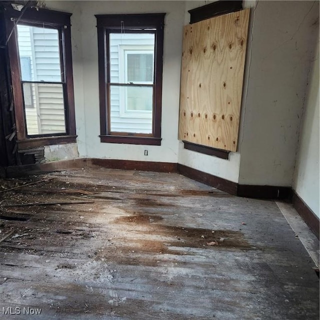 unfurnished room featuring a wealth of natural light