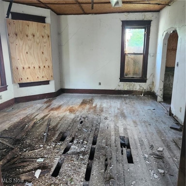 spare room with wood-type flooring