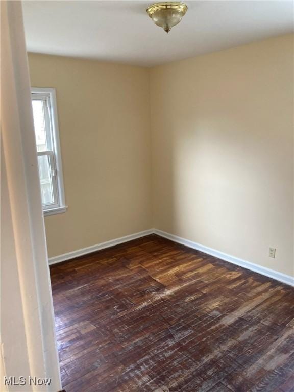 empty room featuring dark hardwood / wood-style floors