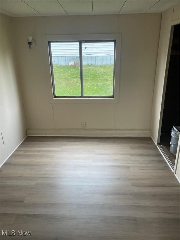 spare room featuring light wood-type flooring