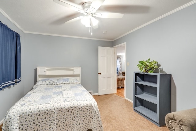 carpeted bedroom with crown molding and ceiling fan