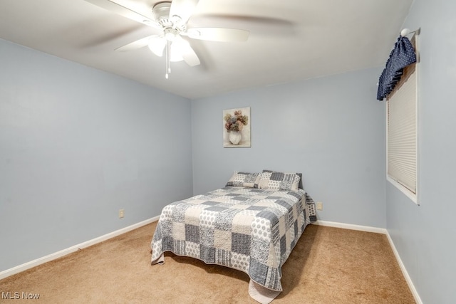 bedroom featuring light colored carpet and ceiling fan