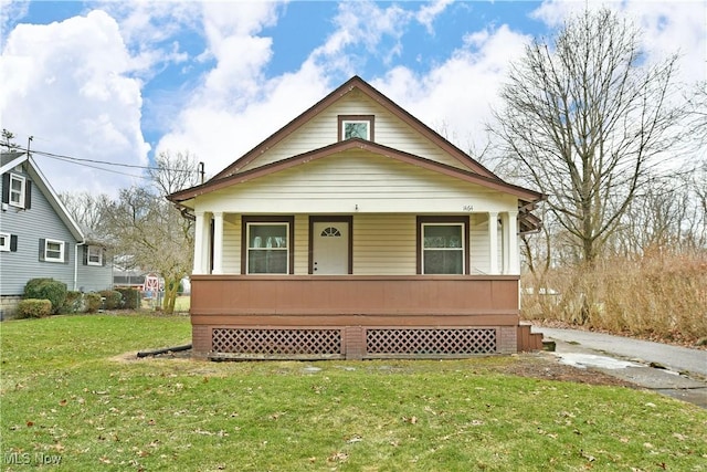 bungalow featuring a porch and a front yard