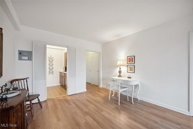 office with light hardwood / wood-style flooring